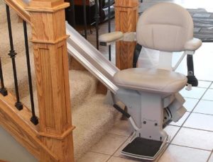 stair lift at bottom landing of staircase in home in Chicago suburb