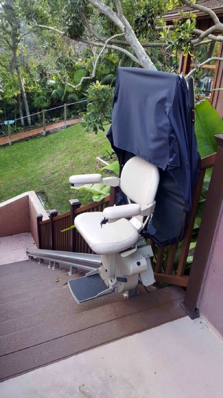 Bruno Outdoor Elite stairlift with protective cover in San Francisco