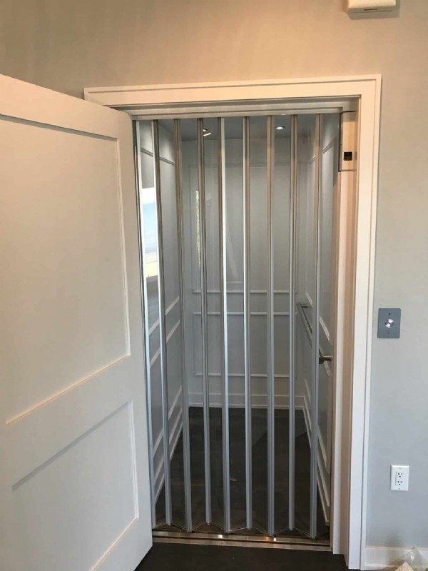 clear accordion doors on residential elevator installed in LA by Lifeway Mobility