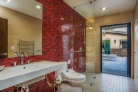 accessible bathroom with roll in shower and grab bars in Anahiem CA
