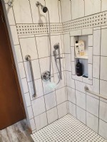 accessible shower with white tile and grab bars in Frankfort IL by EHLS