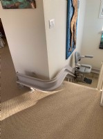 curved stairlift with rail overrun in San Francisco home