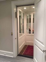 home elevator in Chicago with half wall mirror cab interior