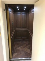 home elevator with oak wood interior in Huntington Beach CA home by Lifeway Mobility