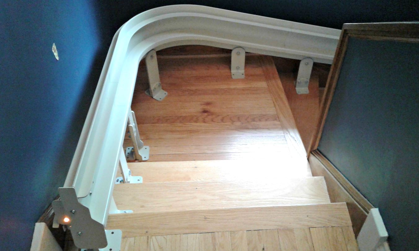 Curved-Stair-Lift-Rail-Attached-to-Stairs